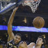 San Antonio Spurs' Tim Duncan, left, battles for a rebound against Golden State Warriors' Andrew Bogut during the second half of Game 3 of a Western Conference semifinal NBA basketball playoff series in Oakland, Calif., Friday, May 10, 2013. San Antonio won 102-92. (AP Photo/Marcio Jose Sanchez).