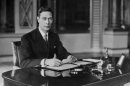 FILE - In this April 8, 1937 file photo, Britain's King George VI at his desk, in Buckingham Palace, London. In choosing to call their first child George Alexander Louis, on Wednesday, July 24, 2013, Prince William and his wife, Kate, selected a first name steeped in British history.While 