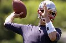 New England Patriots quarterback Tom Brady throws a pass during NFL football practice at the team's training facility in Foxborough, Mass., Thursday, May 31, 2012. (AP Photo/Stephan Savoia)