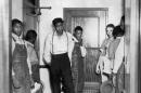 FILE - In this 1937 file photo, the Scottsboro defendants go back to the cells they have occupied for six years in Birmingham, Ala., following arraignment proceedings in Decatur, Ala. (AP Photo)