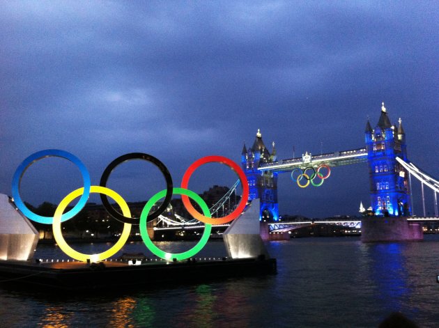 LONDON, ENGLAND - JULY 27:  (EDITORS NOTE: Image was created using a smartphone and processed with Instagram.)  The Olympic rings are seen at Tower Bridge as part of the Opening Ceremony of the London 2012 Olympic Games at the Olympic Stadium on July 27, 2012 in London, England. (Photo by Mark Kolbe/Getty Images)