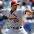 St. Louis Cardinals starting pitcher Adam Wainwright throws during the first inning of a spring training baseball game against the New York Mets, Tuesday, March 26, 2013, in Port St. Lucie, Fla. (AP Photo/Jeff Roberson)
