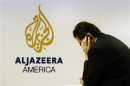 A man works at a desk in the Al Jazeera America broadcast center in New York,