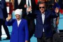 Turkish President Erdogan, accompanied by his wife Emine, greets supporters during a rally to mark the 563rd anniversary of the conquest of the city by Ottoman Turks, in Istanbul