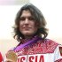 Russian's Ivan Ukhov holds up his gold medal for men's high jump in London