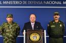 This photo released by the Colombian Defense Ministry Press Office shows Colombian Defense Minister Luis Carlos Villegas (C), Juan Pablo Rodriguez (L), and Rodolfo Palomino during a press conference in Bogota on October 26, 2105