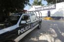 A police pickup is parked by the empty barracks of the Iguala municipal police, whose members were flagged as having collaborated with organized crime, October 6, 2014, in Guerrero state, Mexico