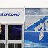 A worker prepares the Boeing chalet ahead of the Farnborough Airshow 2012 in southern England