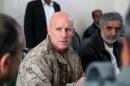 Vice Adm. Robert S. Harward, commanding officer of Combined Joint Interagency Task Force 435, speaks to an Afghan official during his visit to Zaranj, Afghanistan, in this handout photo