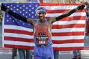Meb Keflezighi poses with the American flag after winnning the U.S. Marathon Olympic Trial on January 14, 2012 in Houston, Texas