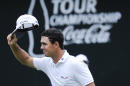 Billy Horschel tips his cap to the crowd as he walks to the 18th green before winning during the Tour Championship golf tournament Sunday, Sept. 14, 2014, in Atlanta. (AP Photo/John Amis)