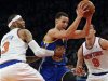 Golden State Warriors' Curry drives between New York Knicks' Martin and Prigioni in their NBA basketball game in New York