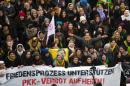 Protestors hold a banner reading " Support Peace Process, lift the ban of PKK" during a rally against the ban on Kurdistan Workers' Party (PKK), on November 16, 2013 in Berlin