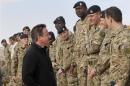 Britain's Prime Minister David Cameron speaks to British soldiers at Camp Bastion, outside Lashkar Gah, in Helmand province, southern Afghanistan