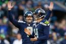Kicker Steven Hauschka (R) of the Seattle Seahawks celebrates with holder Jon Ryan after kicking the game-winning field goal to defeat the Tampa Bay Buccaneers 27-24 in overtime at CenturyLink Field on November 3, 2013 in Seattle, Washington