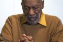 In this Nov. 6, 2014 file photo, entertainer Bill Cosby pauses during a news conference. Cosby's attorney said Sunday, Nov. 16, 2014 that Cosby will not dignify "decade-old, discredited" claims of sexual abuse with a response, the first reaction from the comedian to an increasing uproar over allegations that he sexually assaulted several women in the past. (AP Photo/Evan Vucci, File)