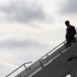 U.S. President Obama disembarks from Air Force One as he arrives for campaign events in Manchester, New Hampshire