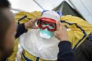Health workers take part in a pre-deployment training for staff heading to Ebola-hit areas on October 29, 2014 in Geneva