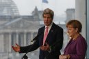 German Chancellor Merkel and U.S. Secretary of State Kerry speak to media at the Chancellery in Berlin