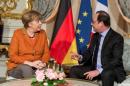 French President Francois Hollande and German Chancellor Angela Merkel meet at the Prefecture in Strasbourg