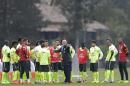 Brazil's coach Luiz Felipe Scolari, center, gives instructions to his players during a training session of the Brazilian national soccer team at the Granja Comary training center in Teresopolis, Brazil, Saturday, June 21, 2014. Brazil plays in group A of the 2014 soccer World Cup. (AP Photo/Andre Penner)