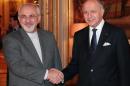 French Foreign Minister Laurent Fabius (R) welcomes his Iranian counterpart Mohammad Javad Zarif on November 5, 2013 in Paris