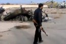 In this image taken from video obtained from the Ugarit News, which has been authenticated based on its contents and other AP reporting, Syrian rebels capture a helicopter air base near the capital Damascus after fierce fighting in Syria, on Sunday, Nov. 25, 2012. The takeover claim showed how rebels are advancing in the area of the capital, though they are badly outgunned by Assad's forces, making inroads where Assad's power was once unchallenged. Rebels have also been able to fire mortar rounds into Damascus recently. (AP Photo/Ugarit News via AP video)