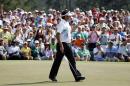 Bubba Watson waves to the gallery after a birdie putt on the ninth hole during the fourth round of the Masters golf tournament Sunday, April 13, 2014, in Augusta, Ga. (AP Photo/Matt Slocum)