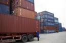 An employee takes notes at a port of Shanghai Free Trade Zone