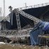 FILE - In this Aug. 14, 2011 file photo, Indiana State Police and authorities survey the collapsed rigging and Sugarland stage on the infield at the Indiana State Fair in Indianapolis. The stage collapse before a Sugarland concert was a late wake-up call for people who manage large public venues like concert grounds and football stadiums. Venue managers gathered in Norman, Okla., Tuesday and Wednesday, March 5-6, with weather forecasters and revealed there have been many close calls. (AP Photo/Darron Cummings, File)