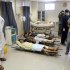 Afghan victims of a suicide attack are seen on stretchers at a hospital in Kandahar, south of Kabul, Afghanistan, Wednesday, June 6, 2012. Two suicide bombers blew themselves up in a market area in southern Afghanistan on Wednesday, killing and wounding scores of people, authorities said. (AP Photo/Allauddin Khan)