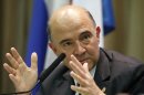 France's Finance Minister Pierre Moscovici attends a news conference in Moscow