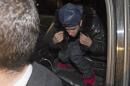 Pop singer Justin Bieber arrives at a police station   in Toronto January 29, 2014. REUTERS/Mark Blinch