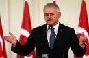 Turkish Prime Minister Binali Yildirim said Turkish troops would remain in Iraq to fight the IS group and "avoid any forceful change of demographic composition in the region"