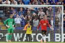 Manchester United players David De Gea, left, and Wayne Rooney react after Leicester's Jamie Vardy scored against Manchester United during the English Premier League soccer match between Leicester City and Manchester United at King Power Stadium, in Leicester, England, Sunday, Sept. 21, 2014. (AP Photo/Rui Vieira)