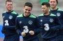 Ireland's midfielder Robbie Brady (C) runs with teammates during a training session at the Montbauron Stadium in Versailles on June 15, 2016