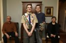 In this Monday, Feb. 4, 2013 photo, Pascal Tessier, 16, center left, a Boy Scout, and his brother Lucien Tessier, 20, who had earned the rank of Eagle Scout, pose for a portrait with their parents, Oliver Tessier, left, and Tracie Felker, at their home in Kensington, Md. The two Tessier boys enjoyed Cub Scouts, progressed to Boy Scouts, and continued to thrive there even as many in their troop became aware that each boy was gay. The family is grateful for that, but fervently hopes the BSA's top leaders officially scrap the ban so that open acceptance becomes the norm for Scout units nationwide. (AP Photo/Jacquelyn Martin)