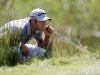 Dustin Johnson reads the green on the second hole during the final round of the Deutsche Bank Championship PGA golf tournament at TPC Boston in Norton, Mass., Monday, Sept. 3, 2012. (AP Photo/Michael Dwyer)