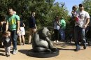 People gather at the giant panda exhibit at the Smithsonian's National Zoo in Washington