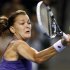 Radwanska of Poland returns a shot against Kerber of Germany during their semi-final singles match at the Pan Pacific Open tennis tournament in Tokyo