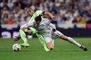 Manchester City's midfielder Fernando (L) vies with Real Madrid's forward Gareth Bale during the UEFA Champions League semi-final second leg football match in Madrid, on May 4, 2016