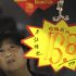 A customer looks at price tags at a supermarket in Hefei