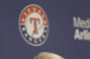 Texas Rangers CEO and President Nolan Ryan wipes his eye during a news conference announcing his retirement from the ballclub Thursday, Oct. 17, 2013 in Arlington, Texas. Ryan will step down at the end of this month. (AP Photo/LM Otero)