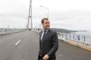 Russian PM Medvedev takes part in the opening ceremony of the newly built bridge over the Eastern Bosphorus Strait in Vladivostok