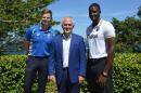 Australia's Prime Minister Malcolm Turnbull (C) poses for a photo with Australian cricket captain Steve Smith (L) and West Indies cricket captain Jason Holder (R) at a reception for the teams at Kirribilli House in Sydney on January 1, 2016