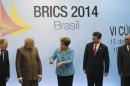 Russian President Putin, Indian Prime Minister Modi, Brazilian President Rousseff, Chinese President Xi and South African President Zuma talk at a group photo session during the 6th BRICS summit in Fortaleza