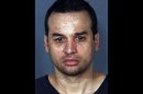 This 2007 image provided by the Las Vegas Metropolitan Police Department shows Alberto Morales. Morales, 42, stabbed one of two police escorts and escaped Monday in the Dallas area as he was being transferred from Florida to Nevada, police said Tuesday Feb. 12, 2013. (AP Photo/LVMPD)