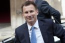 Britain's Culture Secretary Jeremy Hunt arrives to give evidence to the Leveson Inquiry into standards and practices of the media, at the High Court in London