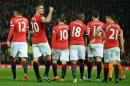 Manchester United players celebrate a goal during the English Premier League football match between Manchester United and Hull City at Old Trafford in Manchester, England, on November 29, 2014