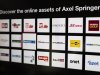 Logos of the digital products of the Axel Springer media group are presented before a news conference on annual results in Berlin